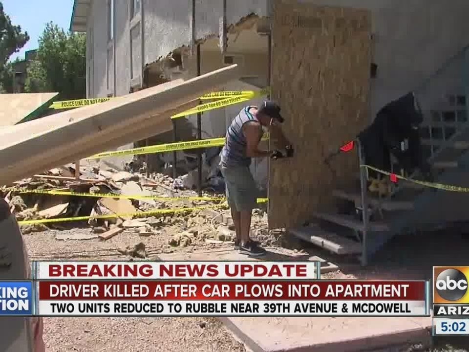 Car plows through two apartments