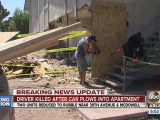 Car plows through two apartments