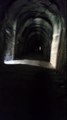 Biking in the Andes - Dark tunnels on the Chaquinan trail -  customized tours by Juan Carlos Guerra