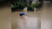 Watch a kid take a dive as France grapples with flooding