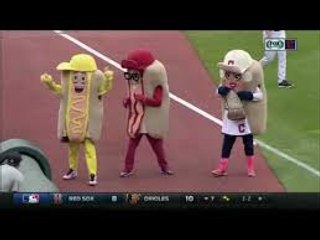 Indians' Jason Kipnis bowls over Ketchup in Hot Dog Derby
