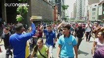 Venezuelans protest as the country suffers hyperinflation, power cuts, and 