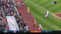 Indians' Jason Kipnis bowls over Ketchup in Hot Dog Derby