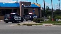 Half-naked man tries to 'flee police' outside Domino's Pizza restaurant