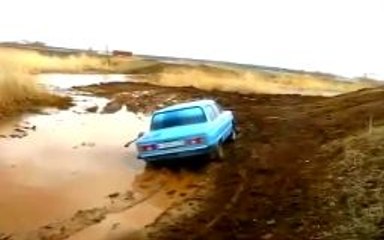 Crazy Driving Through a Mud Puddle