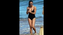 Lea Michele sizzles in black studded swimsuit