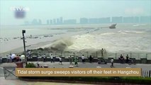 Footage Tidal storm surge sweeps visitors off their feet in Hangzhou