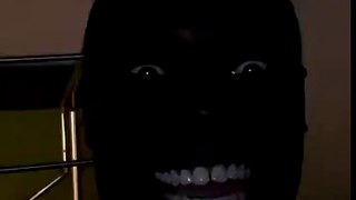 Black Man Laughing in the Dark
