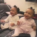 Twins dancing and smiling to mommy’s singing.