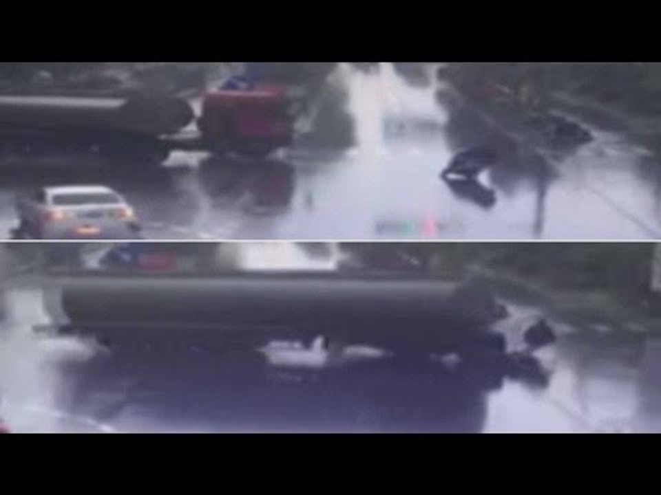 Biker miraculously escapes collision with lorry