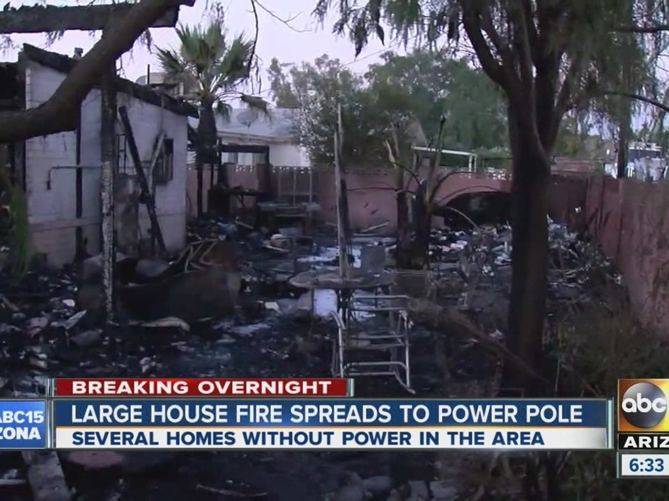 Four people displaced after house fire spreads to power pole