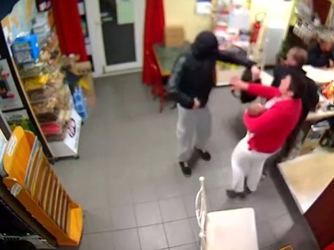 Bar owner fights an armed robber with a baby in her arms