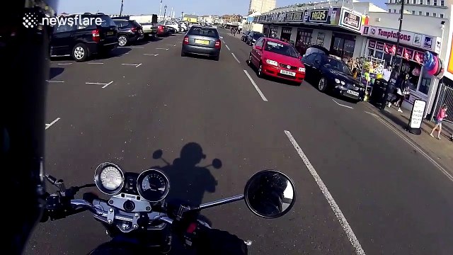 Driver reverses car into bollard