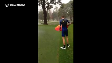 Skimboarding on a golf course during Sydney storm