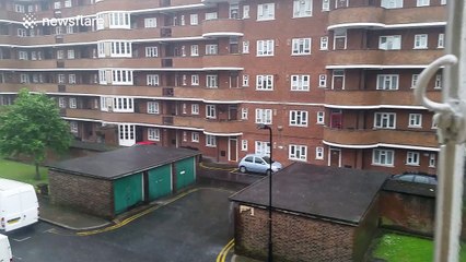 Intense rainstorm interrupts sunshine in London, UK