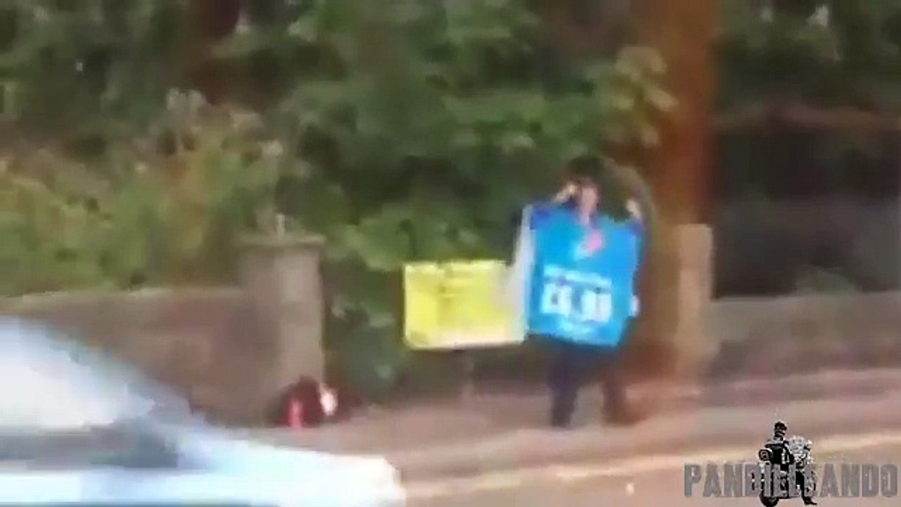 Dancing Domino's worker wows drivers with his smooth moves by side of busy road