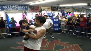 Manny Pacquiao with a Baby - October 26, 2011