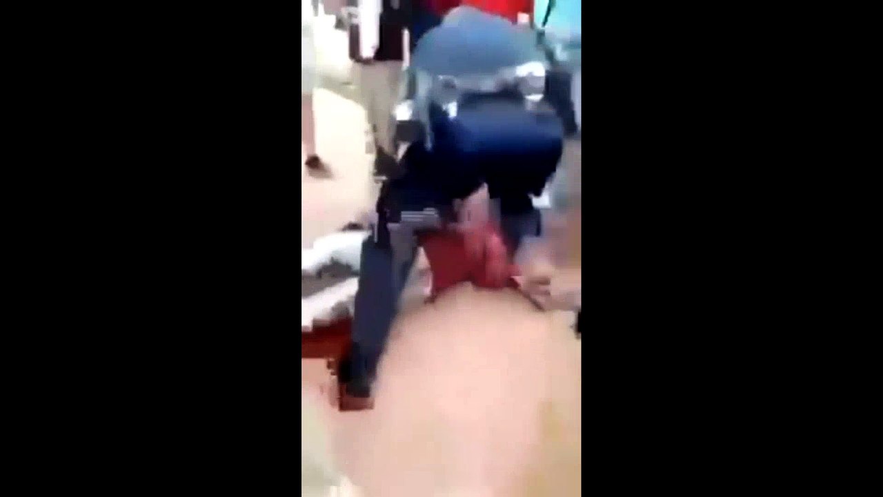 police office slams a girl on her head