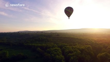 Stunning drone footage of hot air balloons before sunset