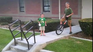 10 Year Old Rides Unicycle Down Stairs.  Brother Chases Him