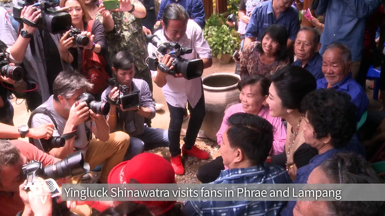 Thai ex-PM Yingluck defies army with selfie and smiles tour