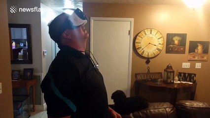 Father breaks picture frame while trying out VR headset for first time