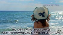 Lonely female looking at stormy waves, summer sun sparkling in sea water surface. Stock Footage