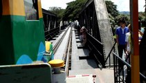 Crossing the River Kwai bridge by train.
