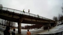 Backflip off a bridge into frozen lake!!