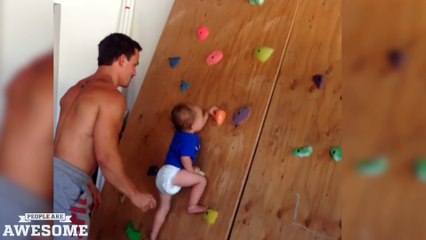 Fearless baby on the rock climbing wall!