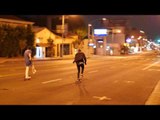 Skaters Glide Down a Deserted Sunset Boulevard