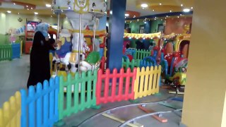 Children riding the train in the amusement park