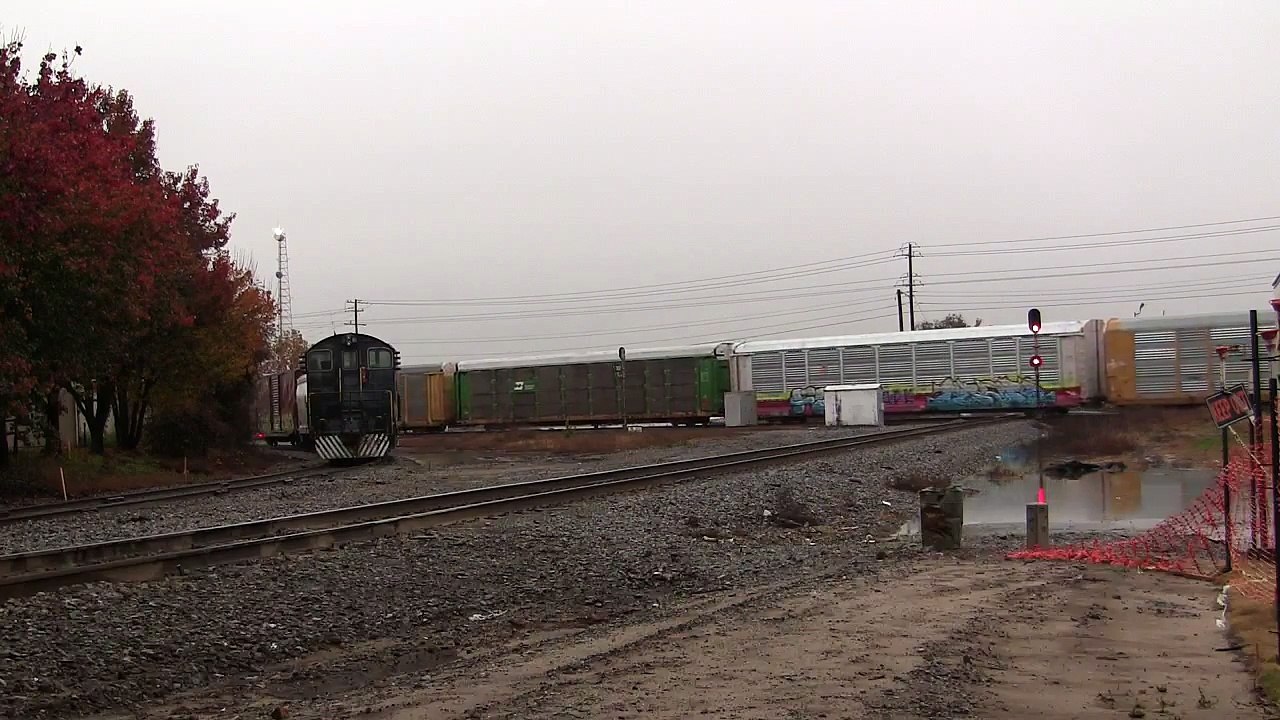CSX CW40-9 9012 leads CSX Q282-25 through downtown Valdosta, GA