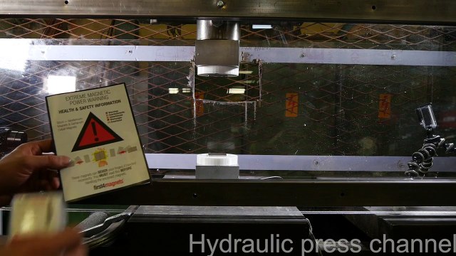 Pressing two repelling neodymium magnets together with hydraulic press