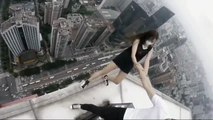 Terrifying video of pair performing stunts atop skyscraper