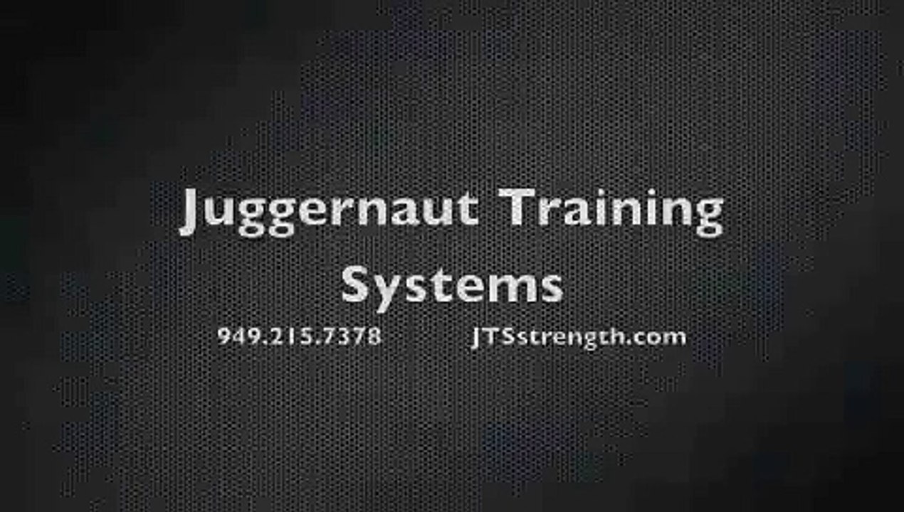 Juggernaut Training Systems-College baseball player seated box jumping 42" holding 25# dumbbells