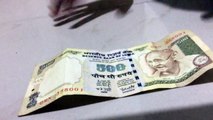 changing a ten rupee note into a 500 rupee note