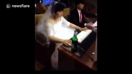 Newlyweds play computer games at an internet cafe