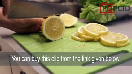 Woman's Hands Sliced Lemon On Chopping Board (video stock footage)