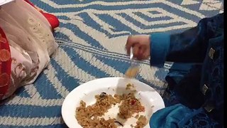 A 2 year old boy eating