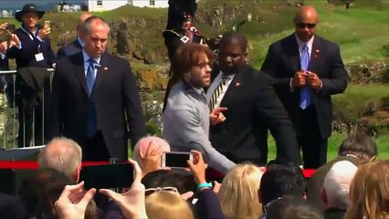 Protester disrupts Trump speech with swastika golfballs