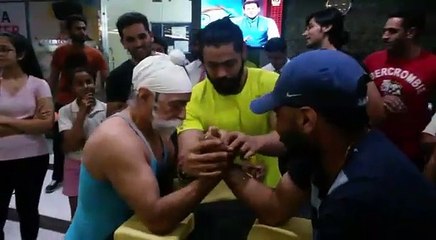 Strong old man beat a young guy