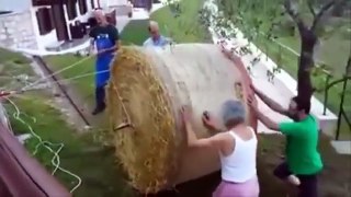 Farmers Lose Bale Of Hay In Spectacular Fashion