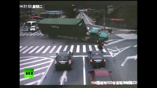 Motorcycle Rider In China Nearly Crushed By Overturned Big Truck!