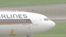 Singapore Airlines plane bursts into flames after emergency landing
