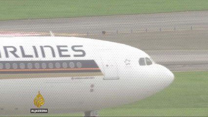 Singapore Airlines plane bursts into flames after emergency landing