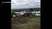 Tractor pulling a tractor pulling a campervan gets stuck at Glastonbury