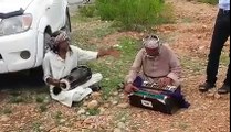 Gumnaam Artists Performing on a Road Side at QA university
