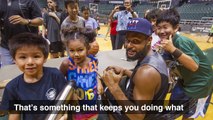 San Antonio Spurs' Patty Mills stops by UH kid's camp