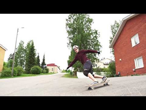 Downhill Freestyle Skateboarder Shows Off His Moves